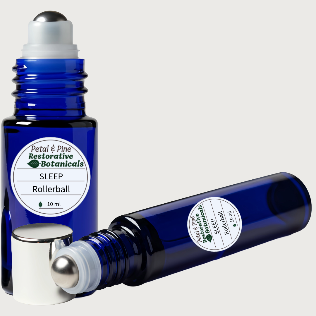 Blue rollerball bottle labeled 'Sleep' by Petal & Pine on a white background